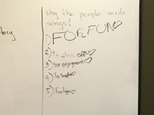 Photo of whiteboard, kids answers to why people write songs